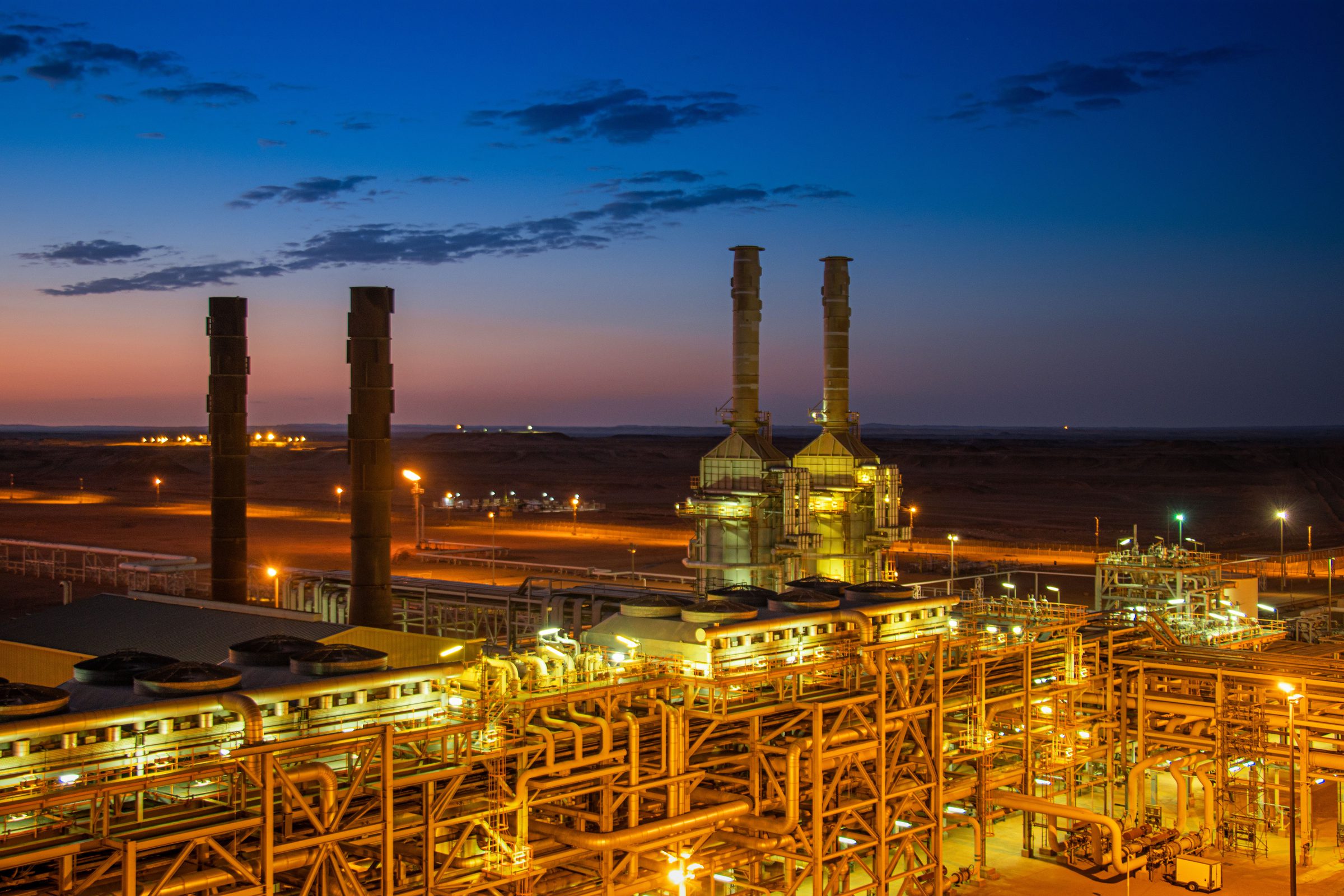 Petrochemical complex lit up at dusk