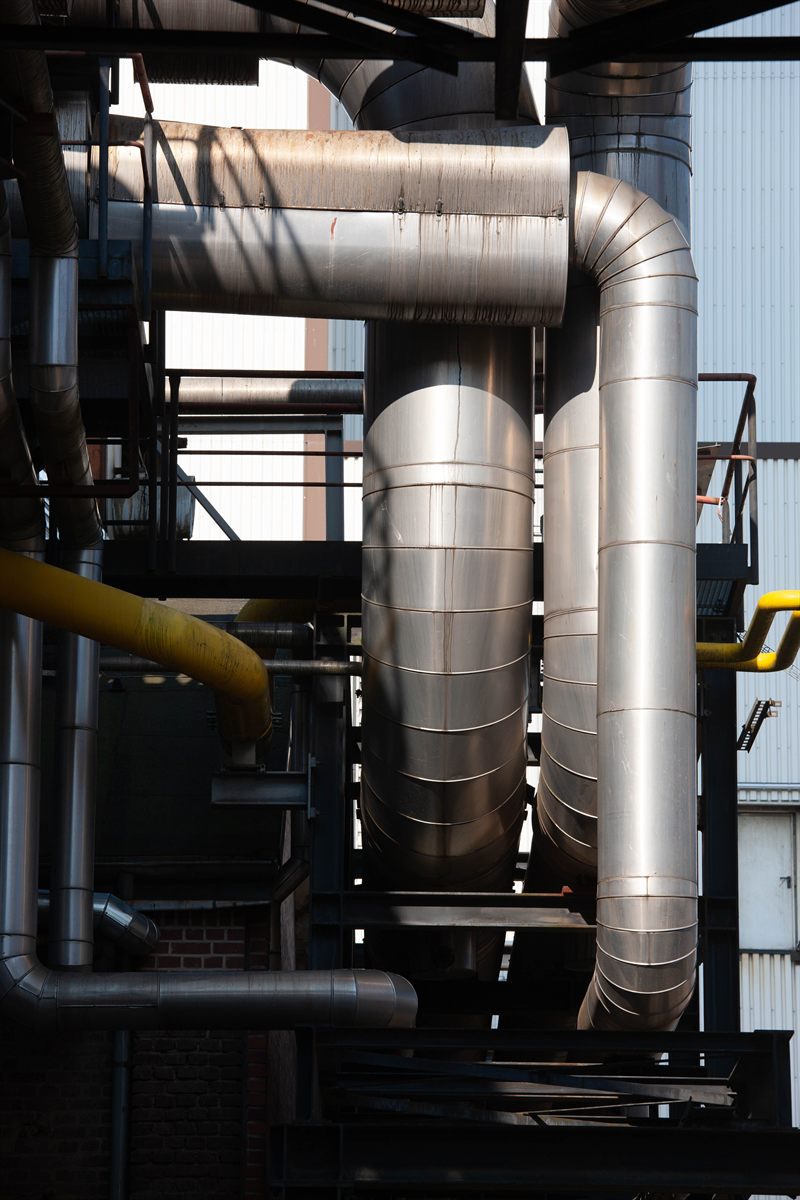 Insulated compressor pipework at a process plant