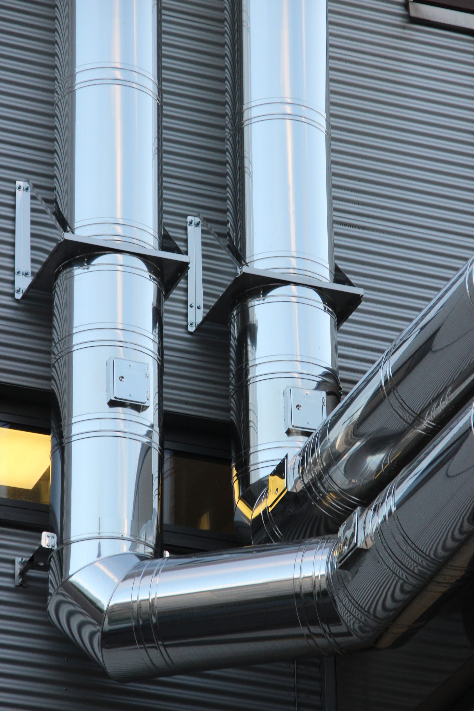 Close-up of gear trains inside industrial rotating machinery